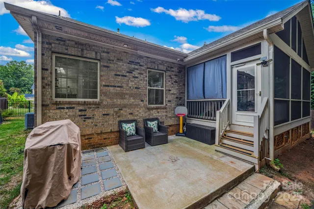 a view of house with patio outdoor seating