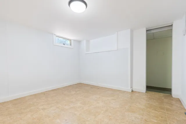a workspace with furniture and a potted plant