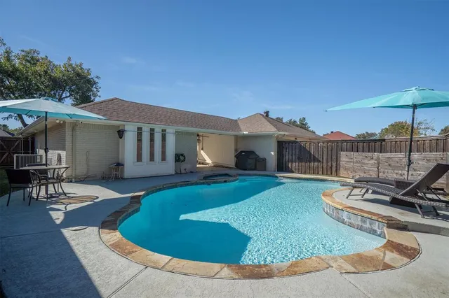 a view of a house with backyard porch and patio