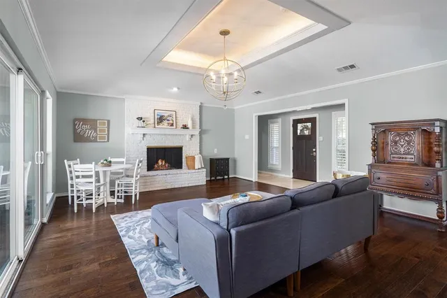 a living room with furniture flat screen tv and fireplace