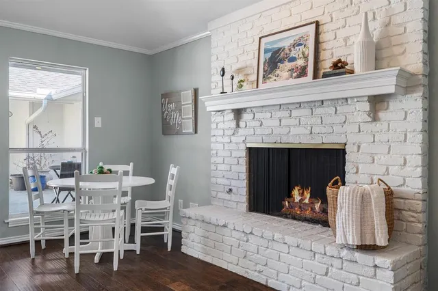 a view of a livingroom with furniture and a fireplace