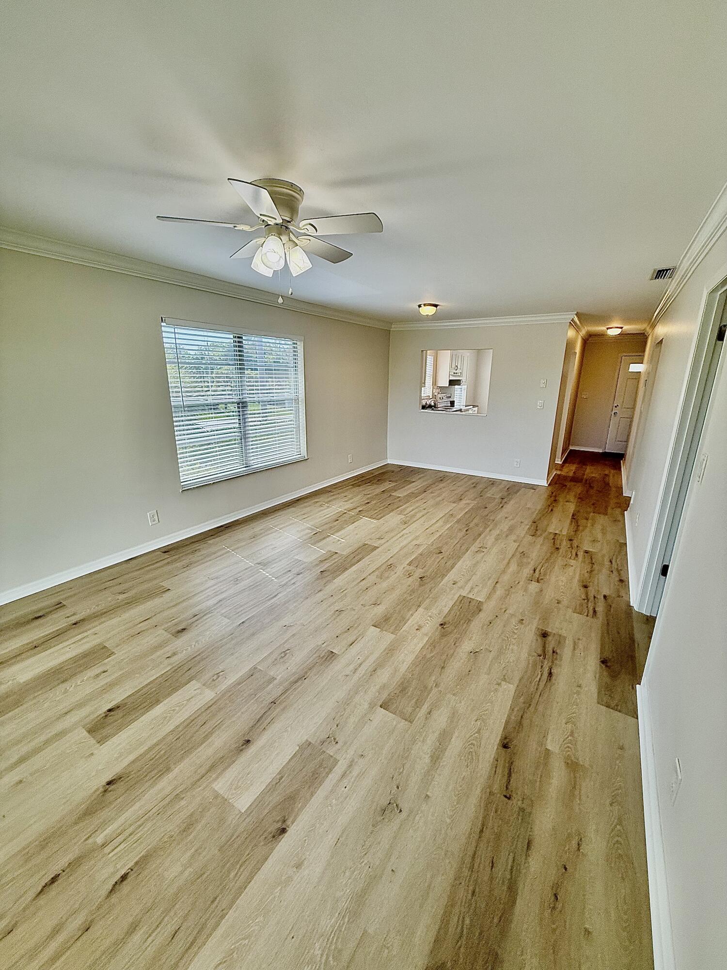 1900 South Kanner Highway, Unit 10207 Stuart, FL 34994 - Photo 1 of 19 a view of empty room with wooden floor