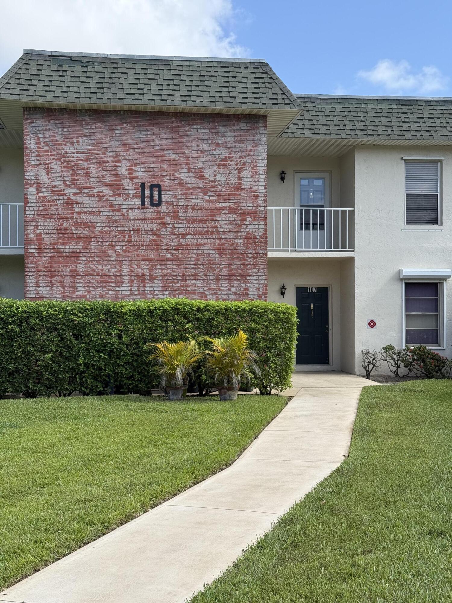 1900 South Kanner Highway, Unit 10207 Stuart, FL 34994 - Photo 17 of 19 a front view of a house with a yard