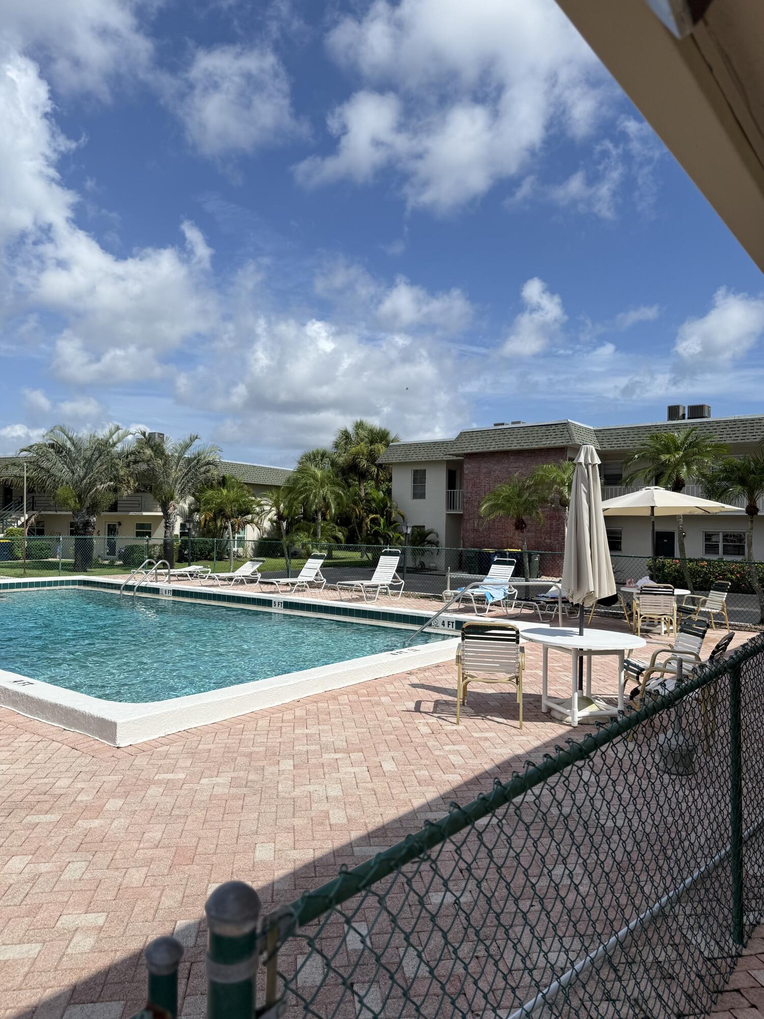 1900 South Kanner Highway, Unit 10207 Stuart, FL 34994 - Photo 19 of 19 a view of swimming pool with outdoor seating and city view