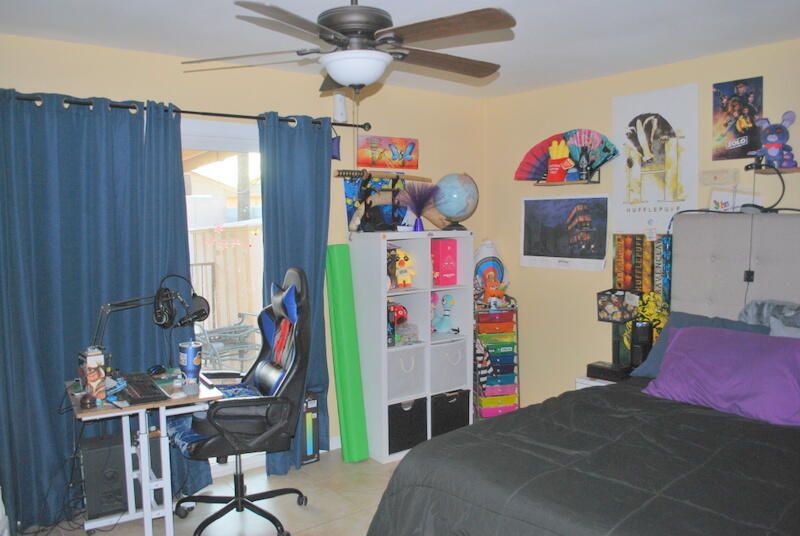 44561 Windsor Drive Indio, CA 92201 - Photo 15 of 22 a bed room with a bed mirror and a window