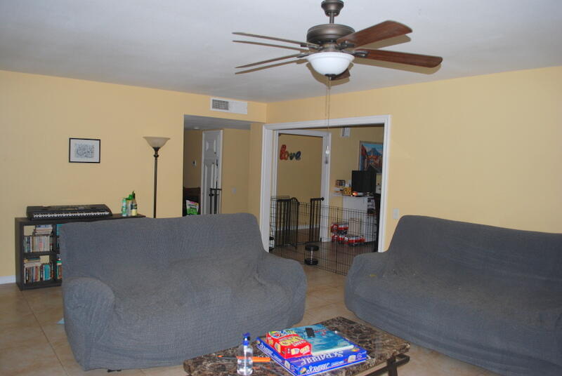 44561 Windsor Drive Indio, CA 92201 - Photo 17 of 22 a living room with furniture and a chandelier