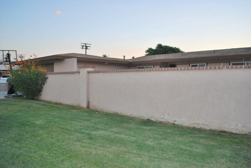 44561 Windsor Drive Indio, CA 92201 - Photo 19 of 22 a view of a house with a yard