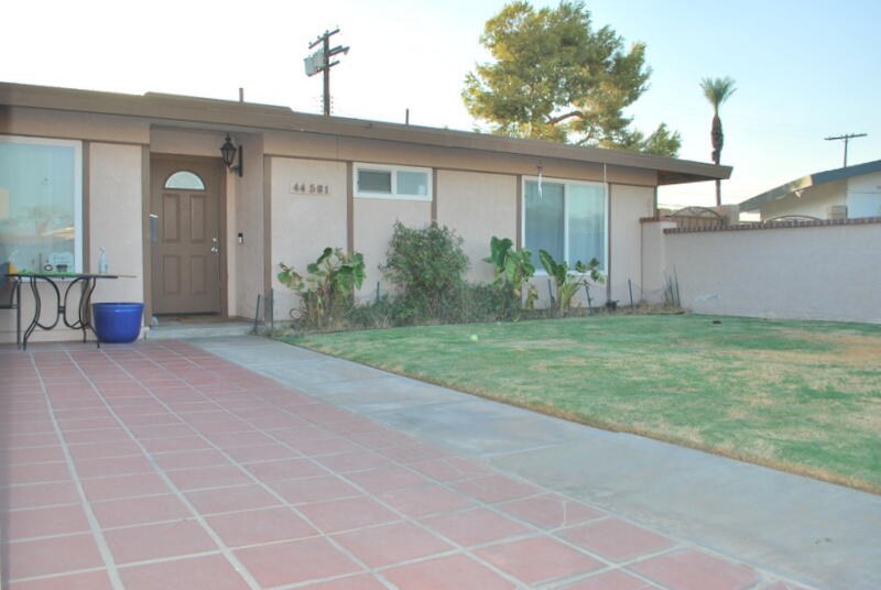 44561 Windsor Drive Indio, CA 92201 - Photo 2 of 22 a view of a house with a backyard