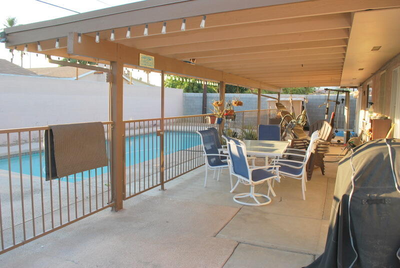 44561 Windsor Drive Indio, CA 92201 - Photo 5 of 22 a view of a patio with table and chairs