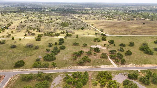 an aerial view of a house with a lake view