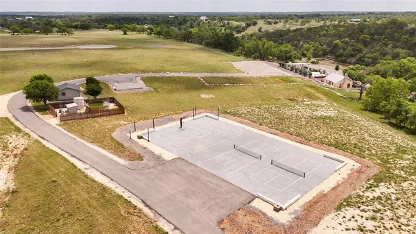 a view of yard with wooden fence