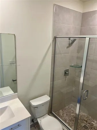 a bathroom with a toilet and a sink