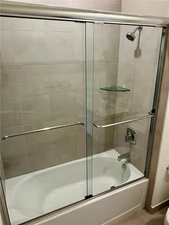a bathroom with a bath tub and a shower