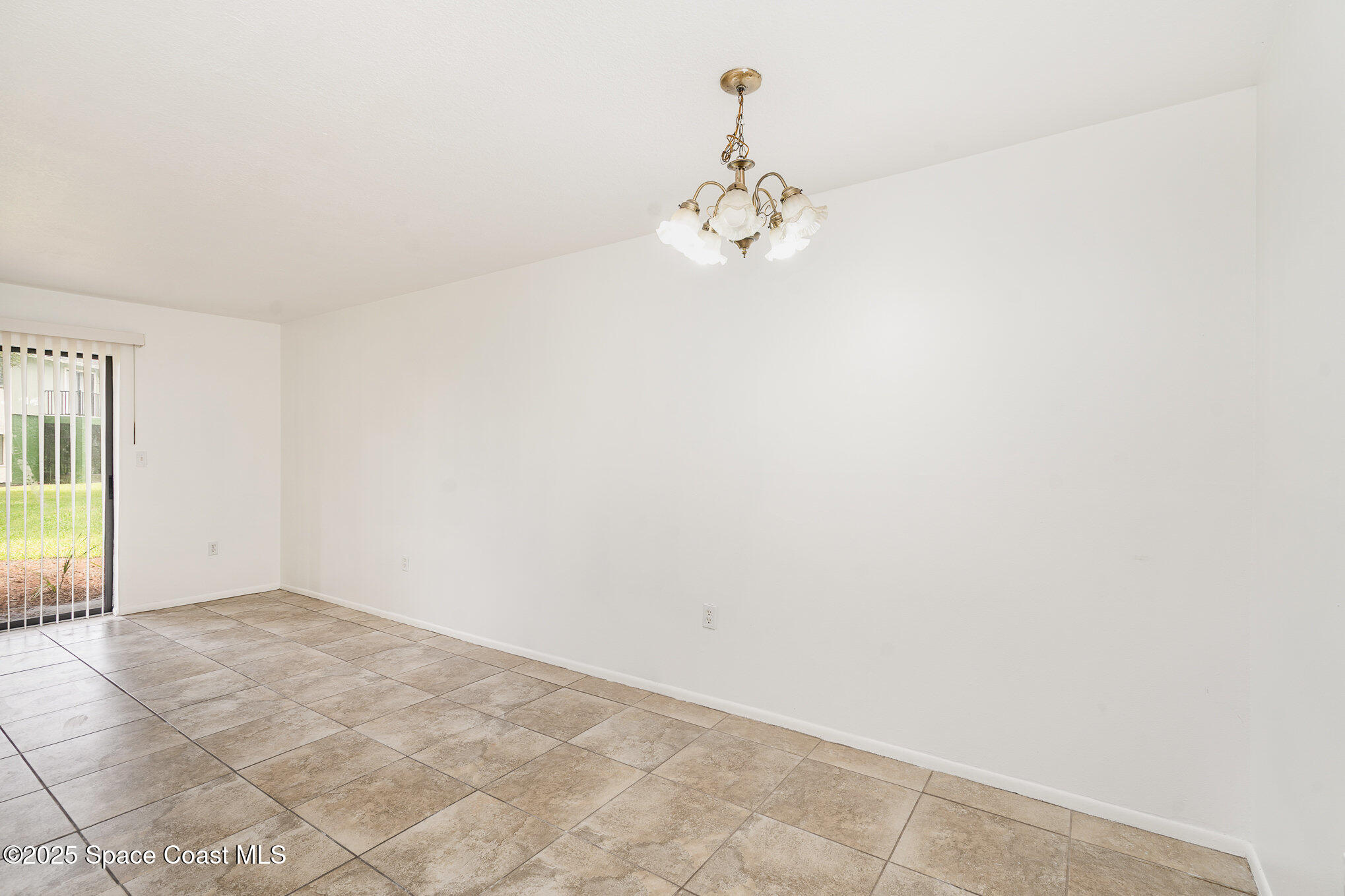2219 Flower Tree Circle Melbourne, FL 32935 - Photo 11 of 26 a view of an empty room with a window