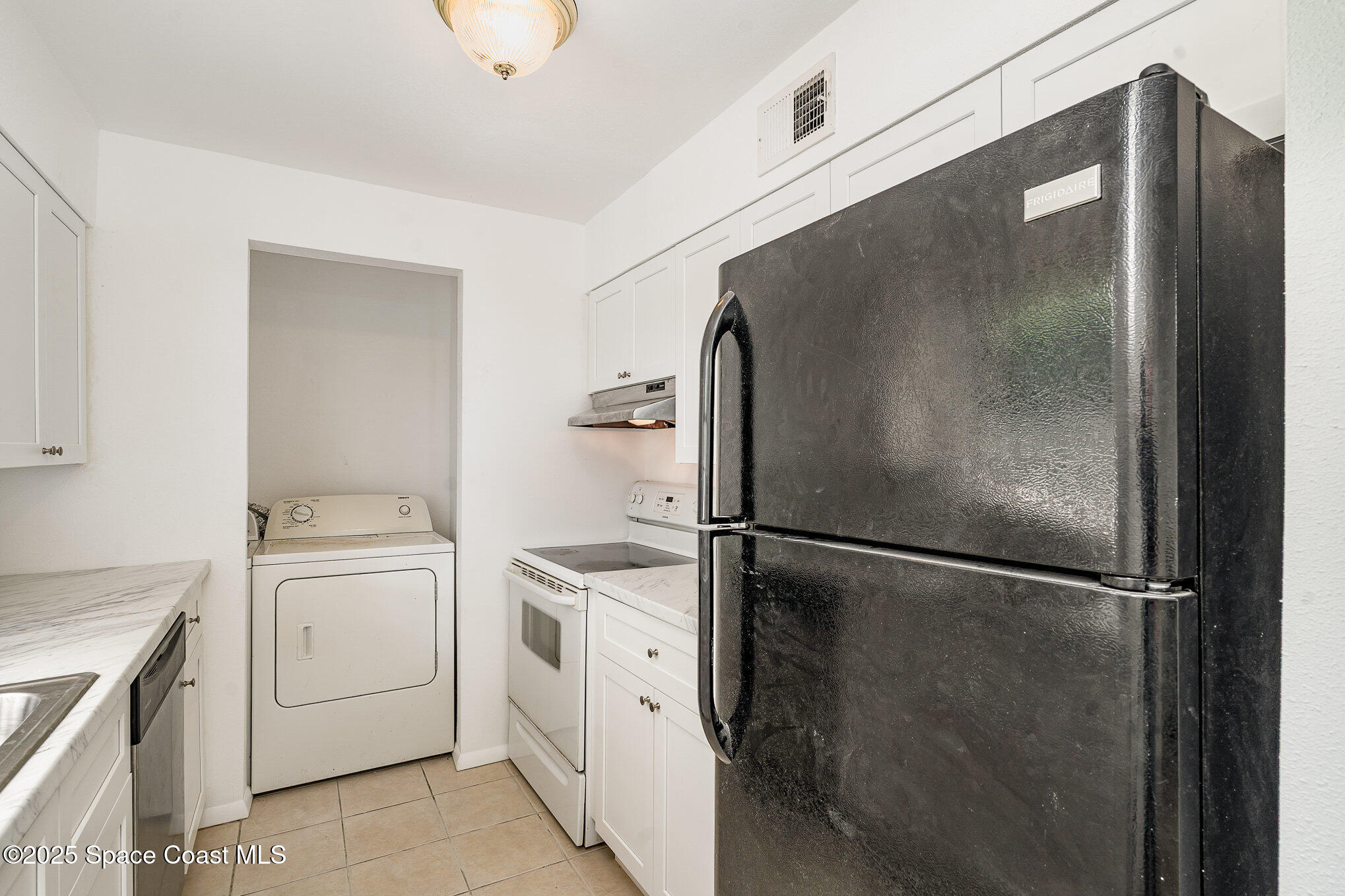 2219 Flower Tree Circle Melbourne, FL 32935 - Photo 15 of 26 a utility room with dryer and washer