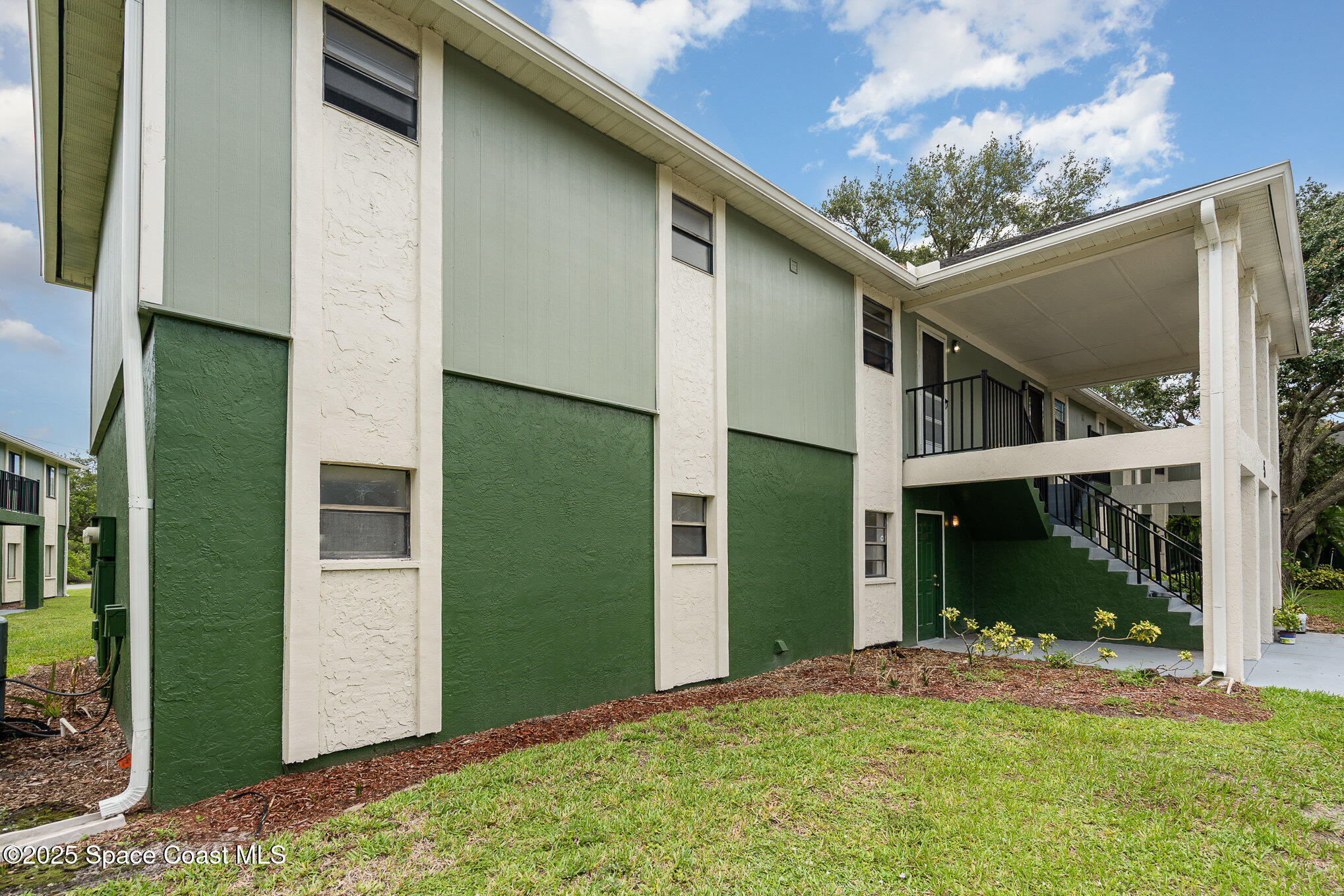 2219 Flower Tree Circle Melbourne, FL 32935 - Photo 25 of 26 a view of a house with a yard