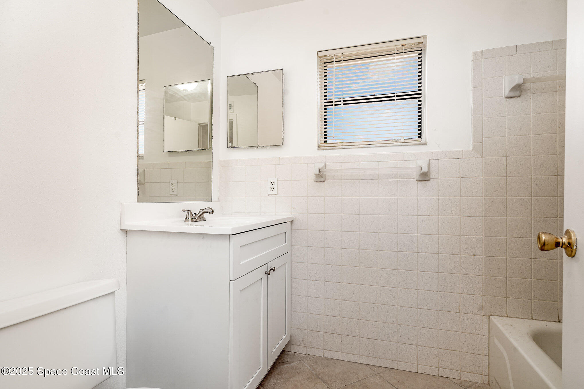 2219 Flower Tree Circle Melbourne, FL 32935 - Photo 5 of 26 a bathroom with a sink a toilet and shower
