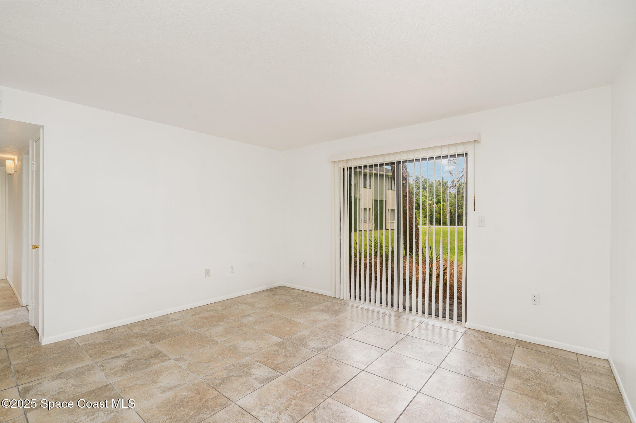 2219 Flower Tree Circle Melbourne, FL 32935 - Photo 7 of 26 a view of a livingroom with a window