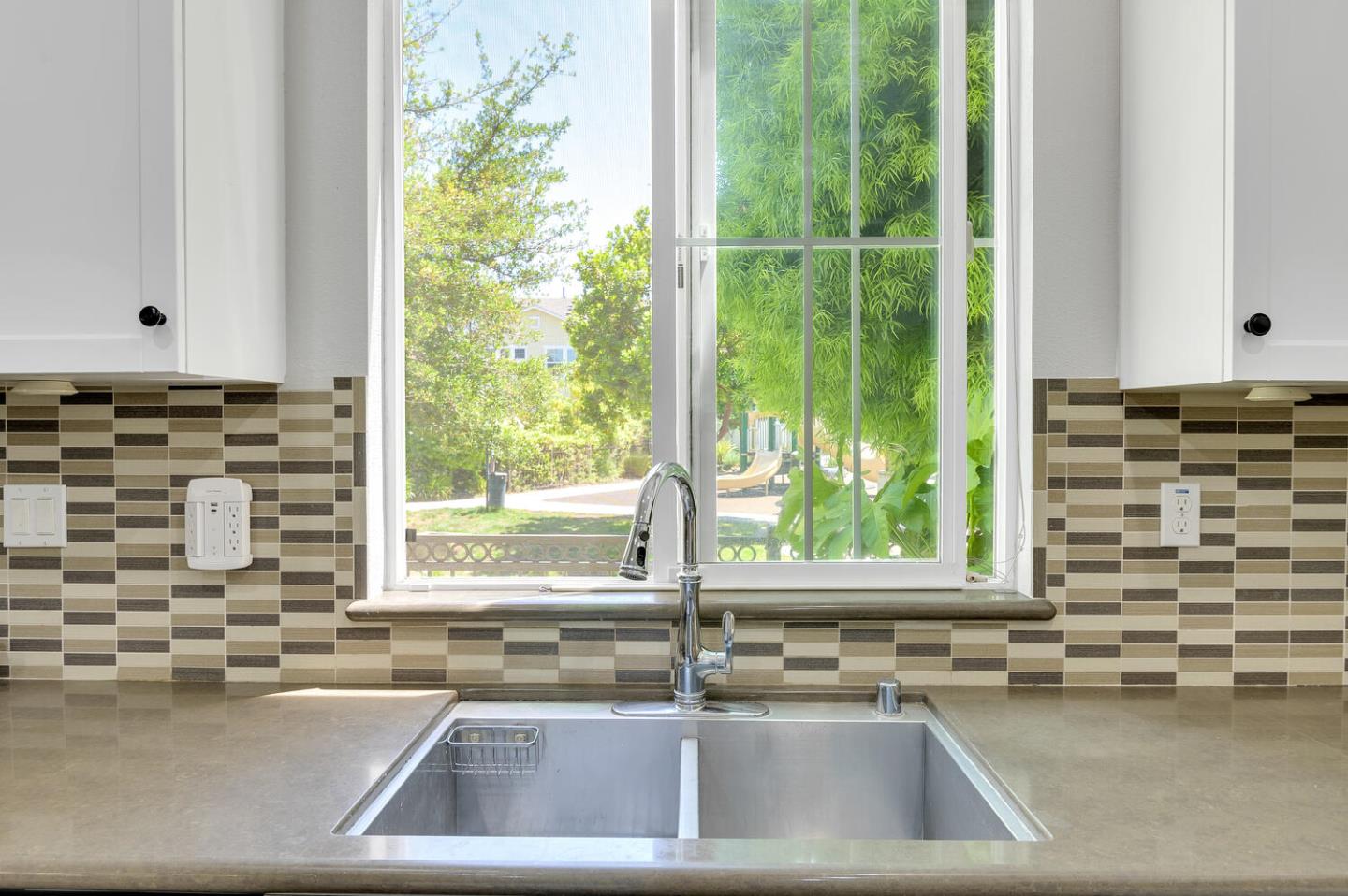 140 Larkspur Loop Morgan Hill, CA 95037 - Photo 13 of 28 a view of a sink and dishwasher with a large window