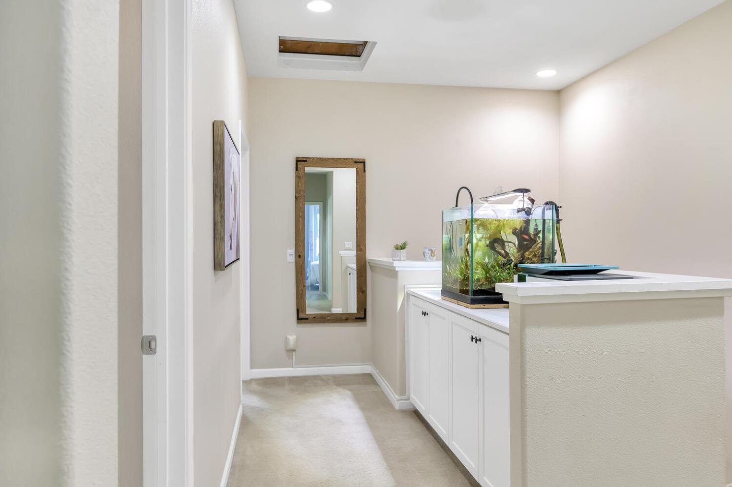 140 Larkspur Loop Morgan Hill, CA 95037 - Photo 16 of 28 a hallway with sink and mirror