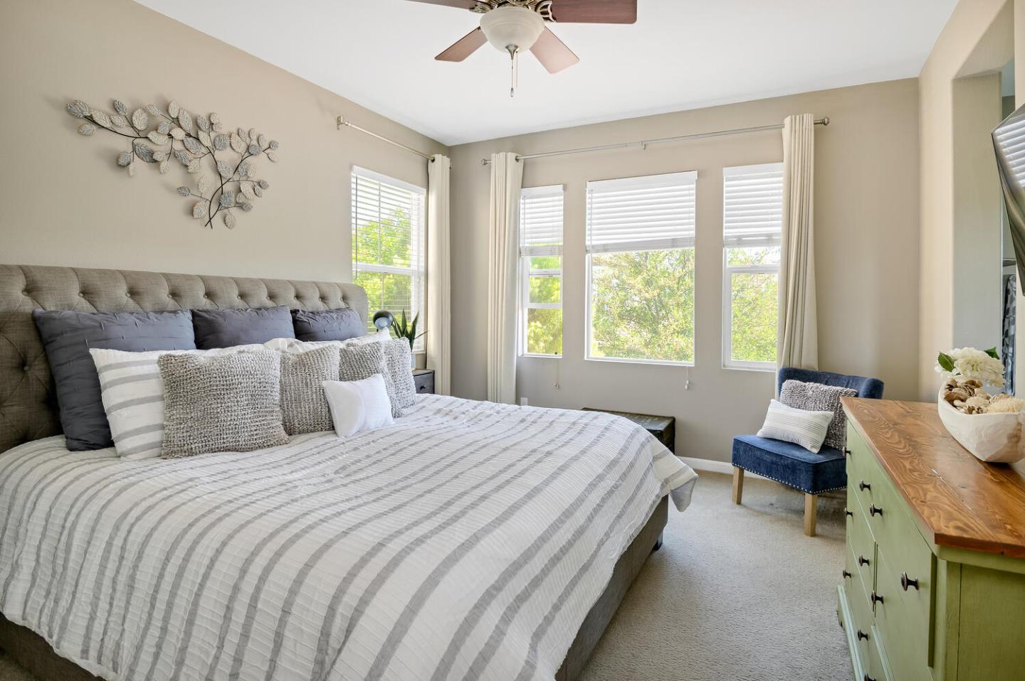 140 Larkspur Loop Morgan Hill, CA 95037 - Photo 17 of 28 a bedroom with a bed and a chandelier