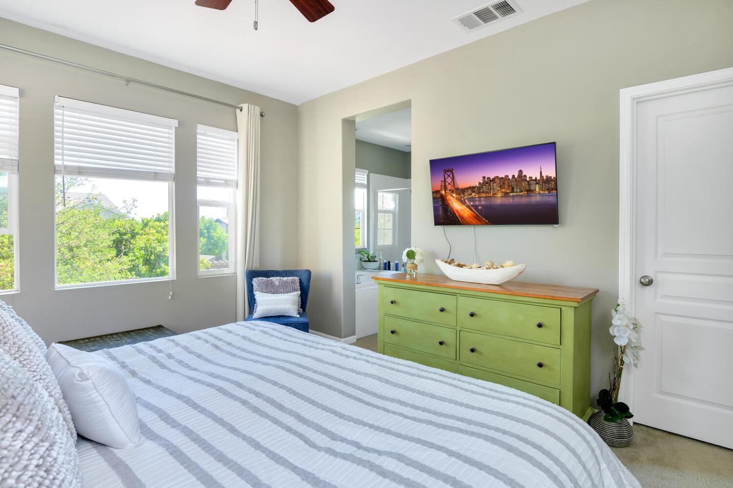 140 Larkspur Loop Morgan Hill, CA 95037 - Photo 18 of 28 a bedroom with a bed and a flat screen tv