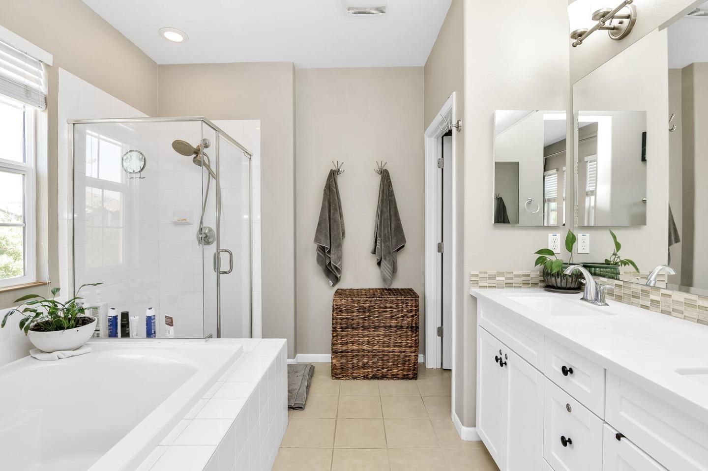 140 Larkspur Loop Morgan Hill, CA 95037 - Photo 19 of 28 a bathroom with a double sink shower and a bathtub