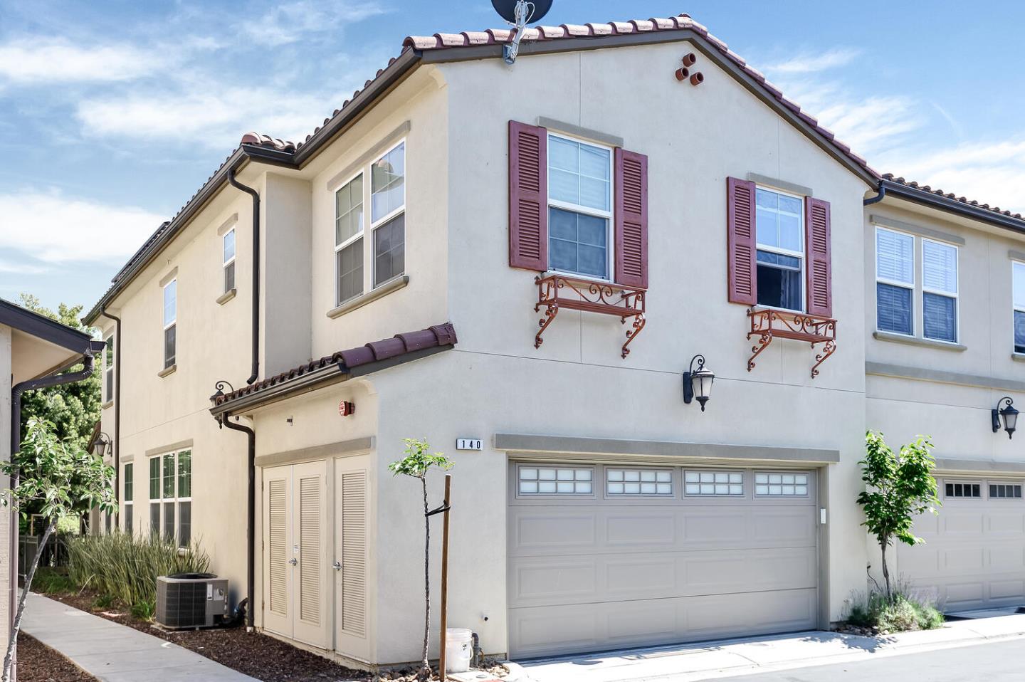 140 Larkspur Loop Morgan Hill, CA 95037 - Photo 2 of 28 a front view of a house with garage