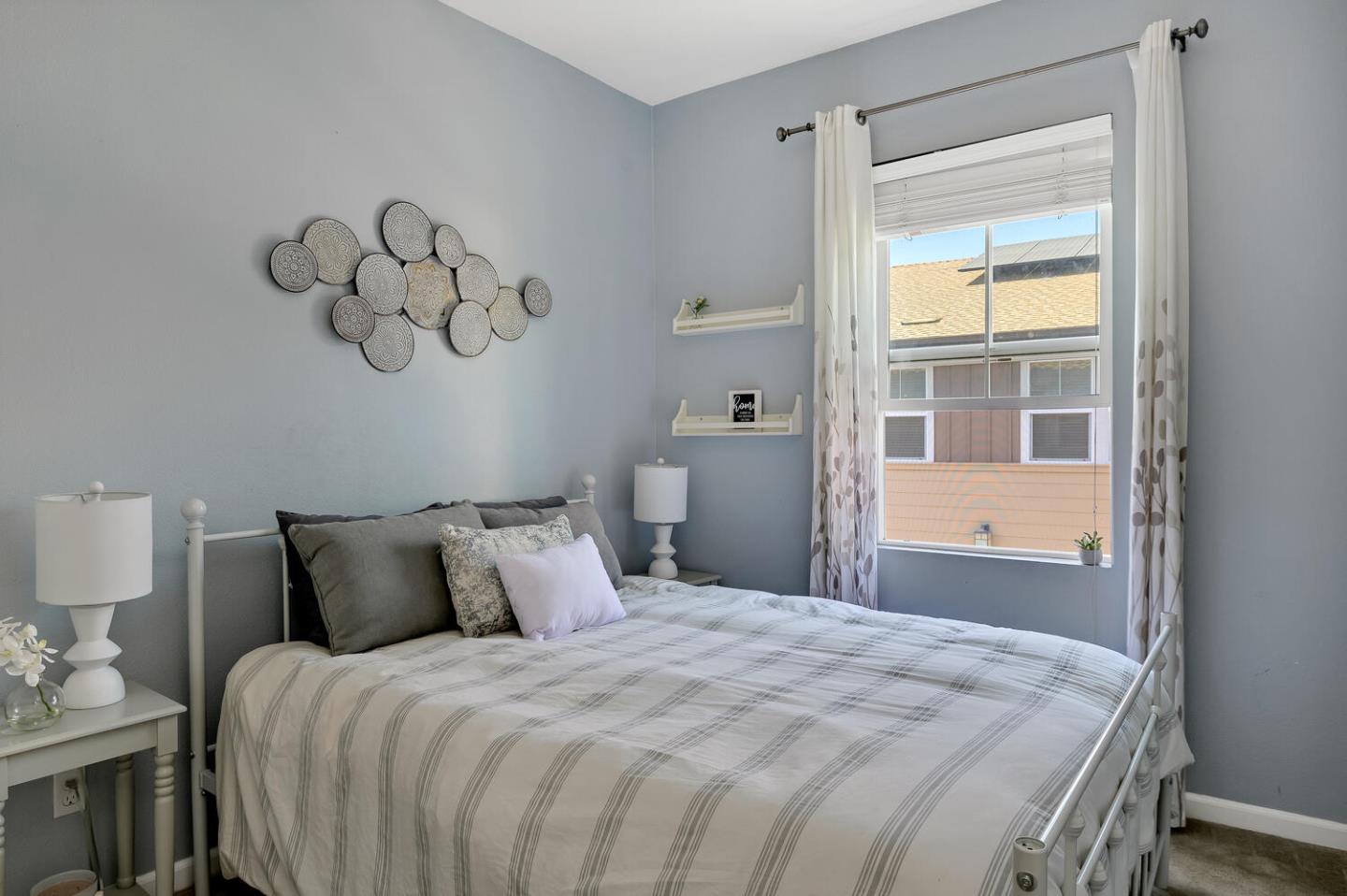 140 Larkspur Loop Morgan Hill, CA 95037 - Photo 24 of 28 a bedroom with a bed and a window