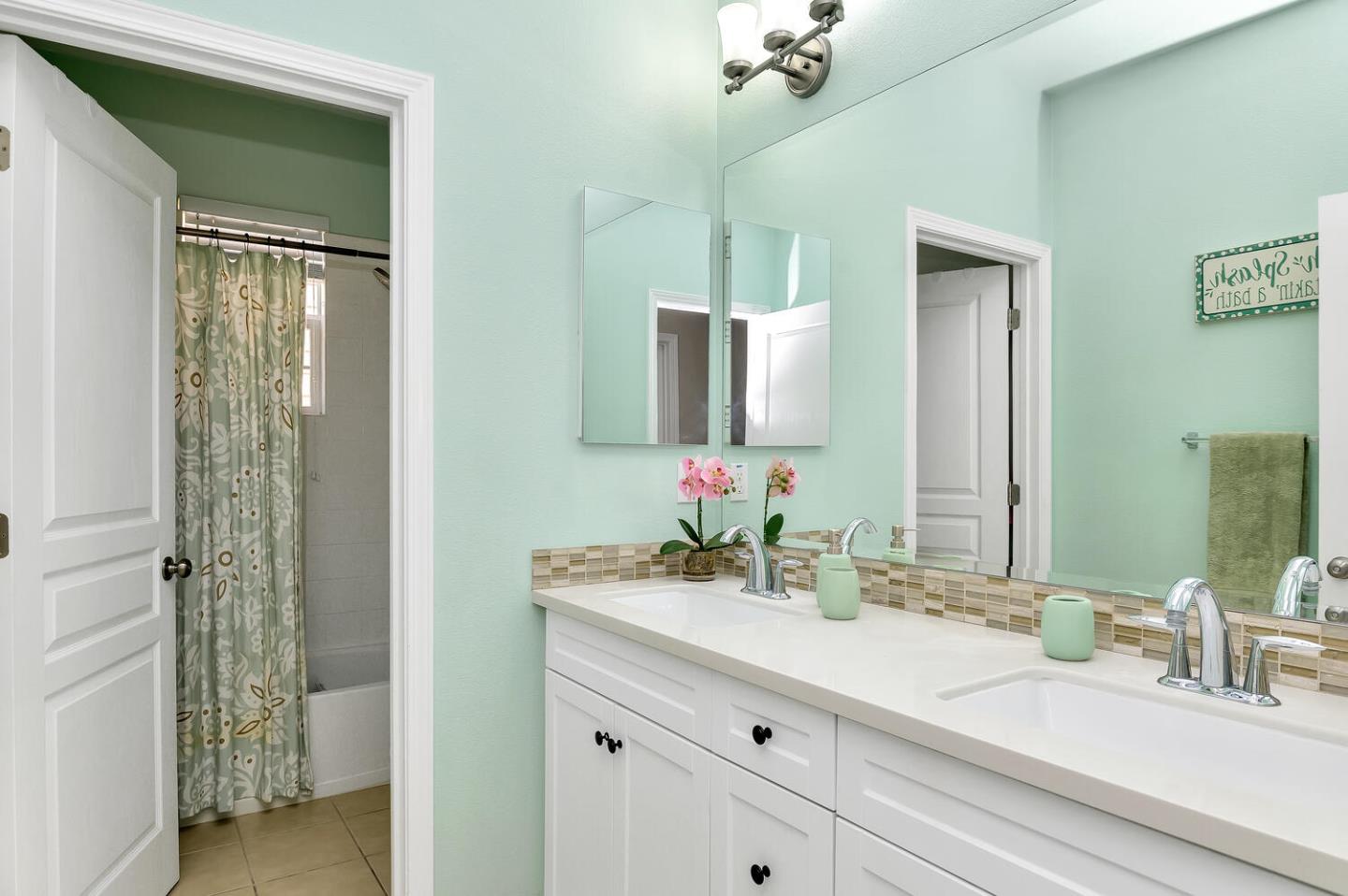 140 Larkspur Loop Morgan Hill, CA 95037 - Photo 25 of 28 a bathroom with a sink and a mirror