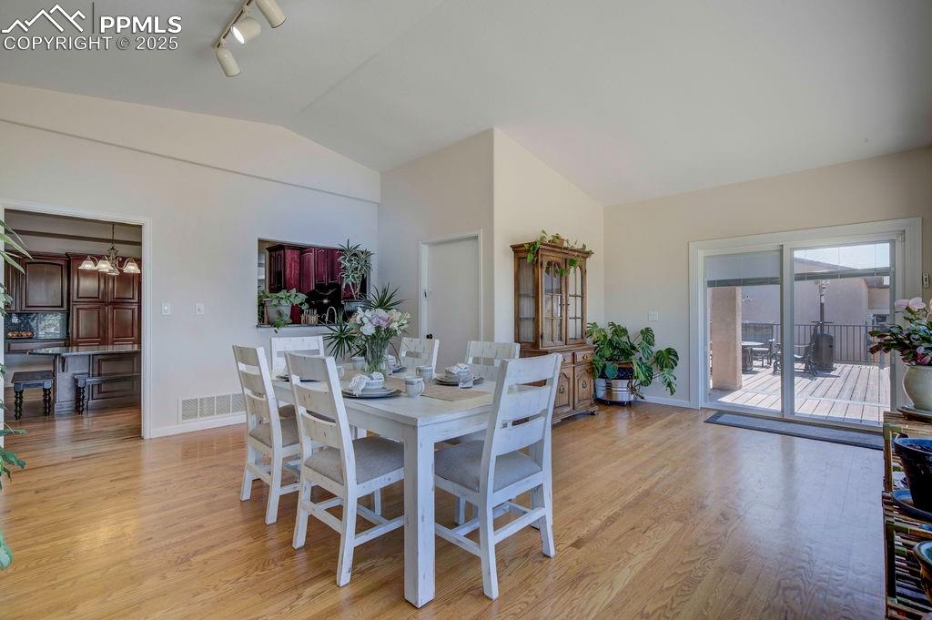 14650 Eastonville Road Elbert, CO 80106 - Photo 13 of 44 a view of a dining room with furniture and wooden floor