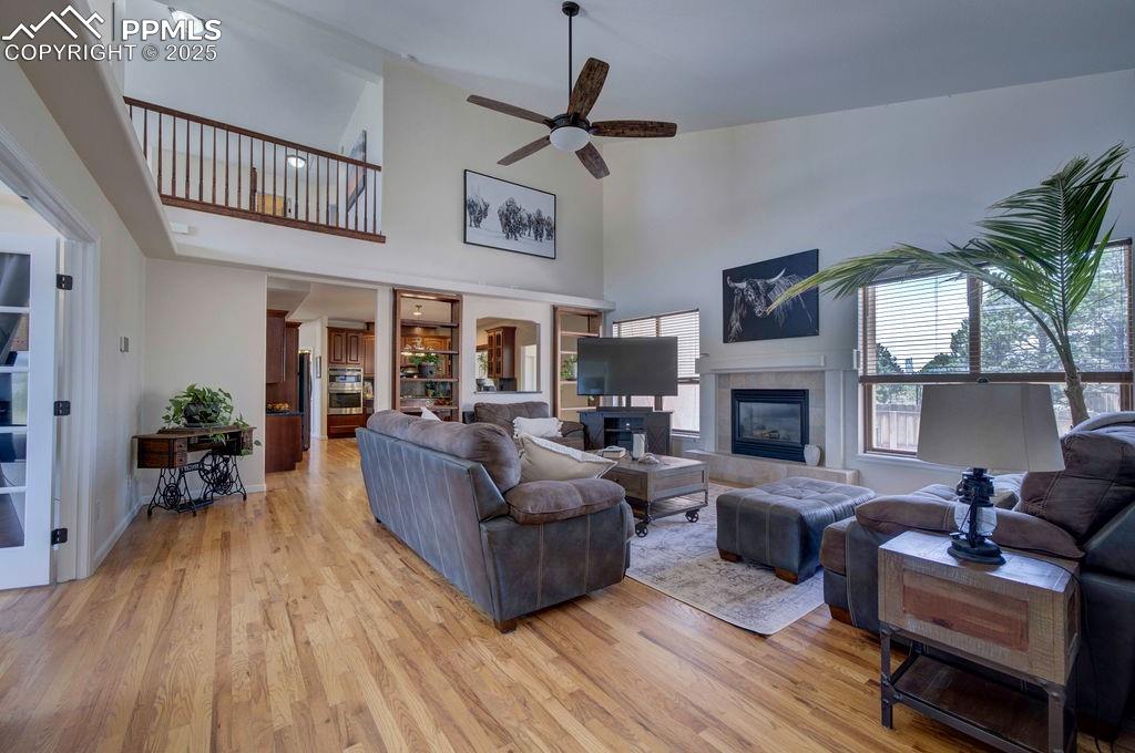 14650 Eastonville Road Elbert, CO 80106 - Photo 16 of 44 a living room with furniture a fireplace and a potted plant