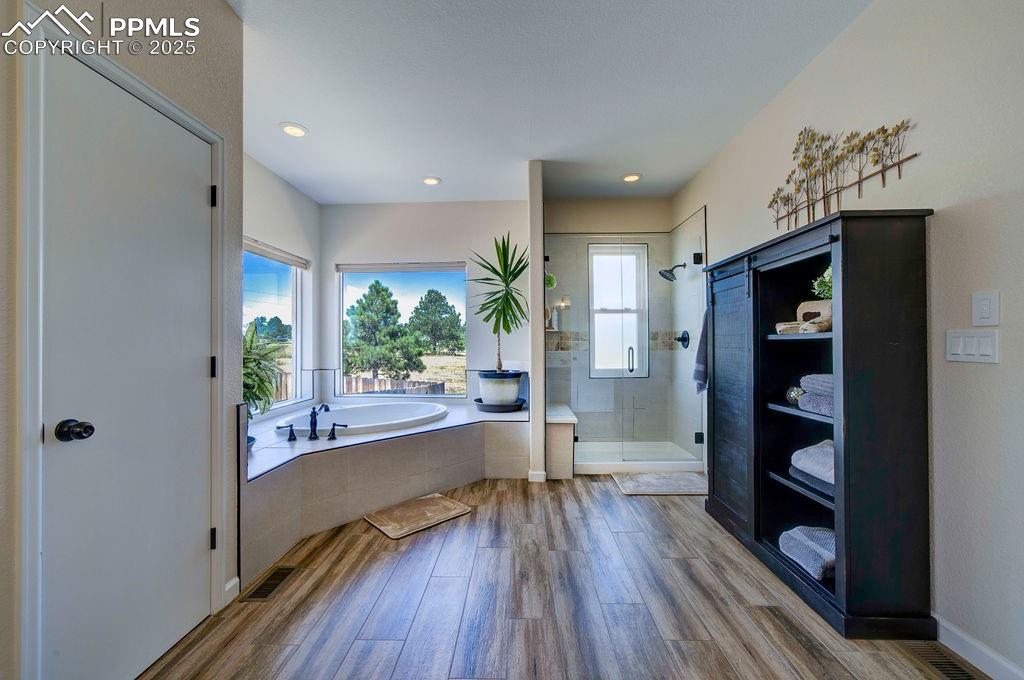14650 Eastonville Road Elbert, CO 80106 - Photo 19 of 44 a view of a hallway view with wooden floor and staircase
