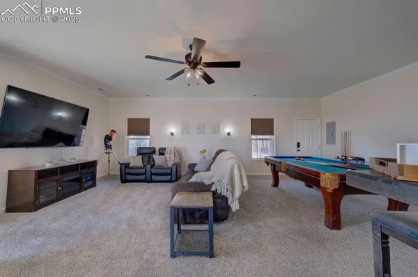 a living room with furniture a air conditioner and a window
