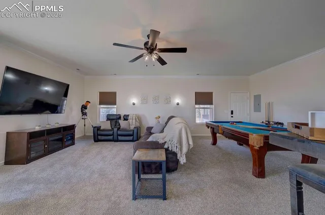 a living room with furniture a air conditioner and a window