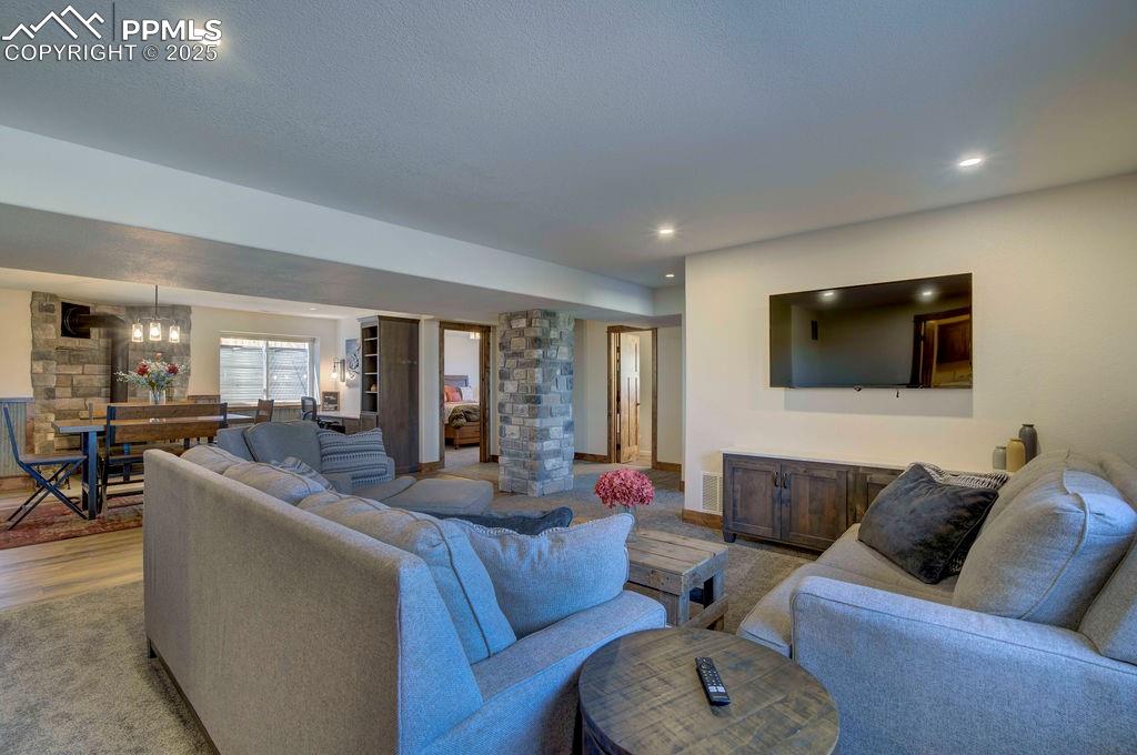 14650 Eastonville Road Elbert, CO 80106 - Photo 34 of 44 a living room with furniture and a flat screen tv