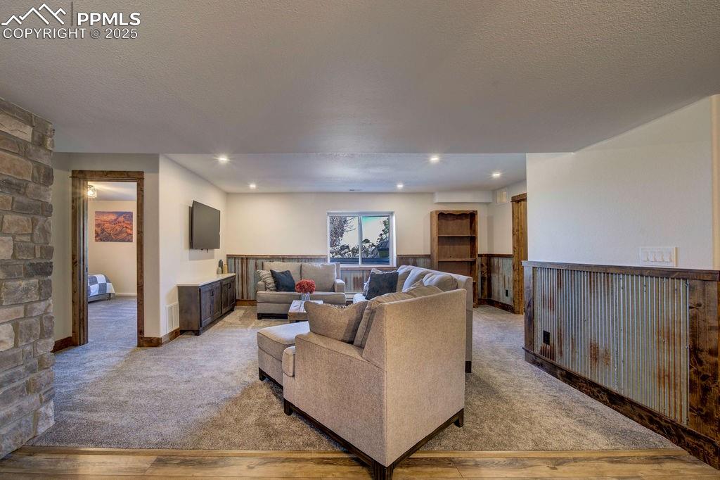 14650 Eastonville Road Elbert, CO 80106 - Photo 35 of 44 a living room with furniture and a wooden floor