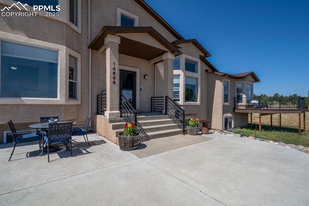 14650 Eastonville Road Elbert, CO 80106 - Photo 4 of 44 a view of a house with patio and a yard