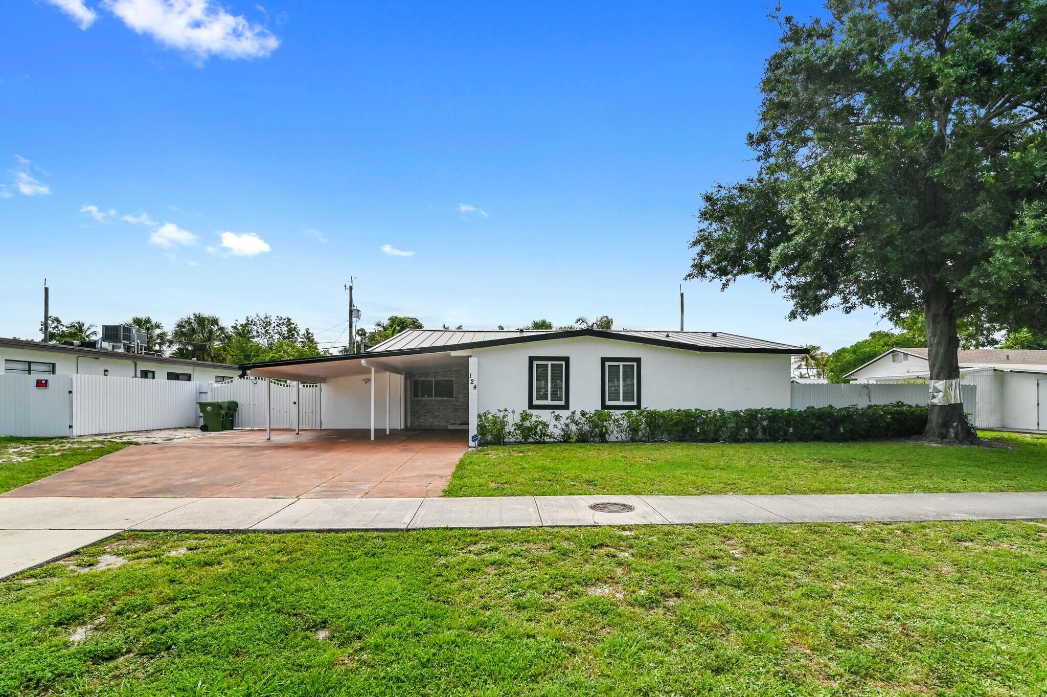 124 Davis Road Palm Springs, FL 33461 - Photo 1 of 44 00002 - 124 Davis Rd