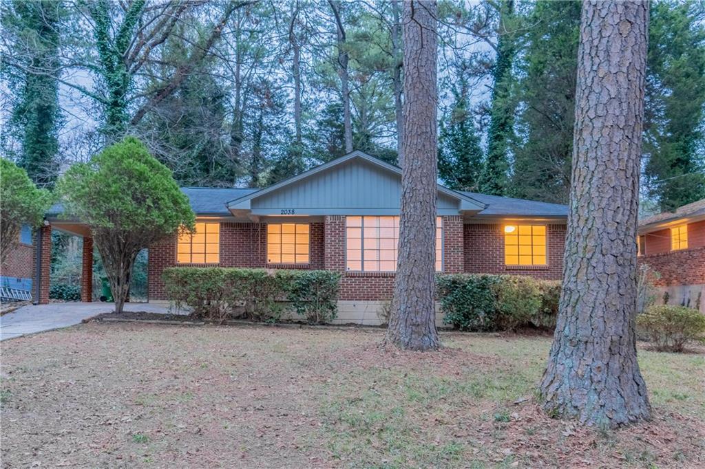 2038 Glendale Drive Decatur, GA 30032 - Photo 1 of 1 a view of a house with large trees and plants