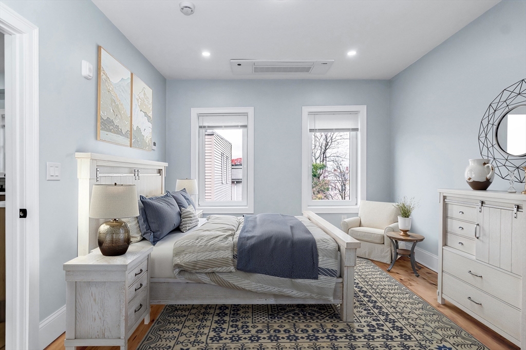 50 Maverick Street, Unit 3 Chelsea, MA 02150 - Photo 22 of 24 a bedroom with a bed and a dresser