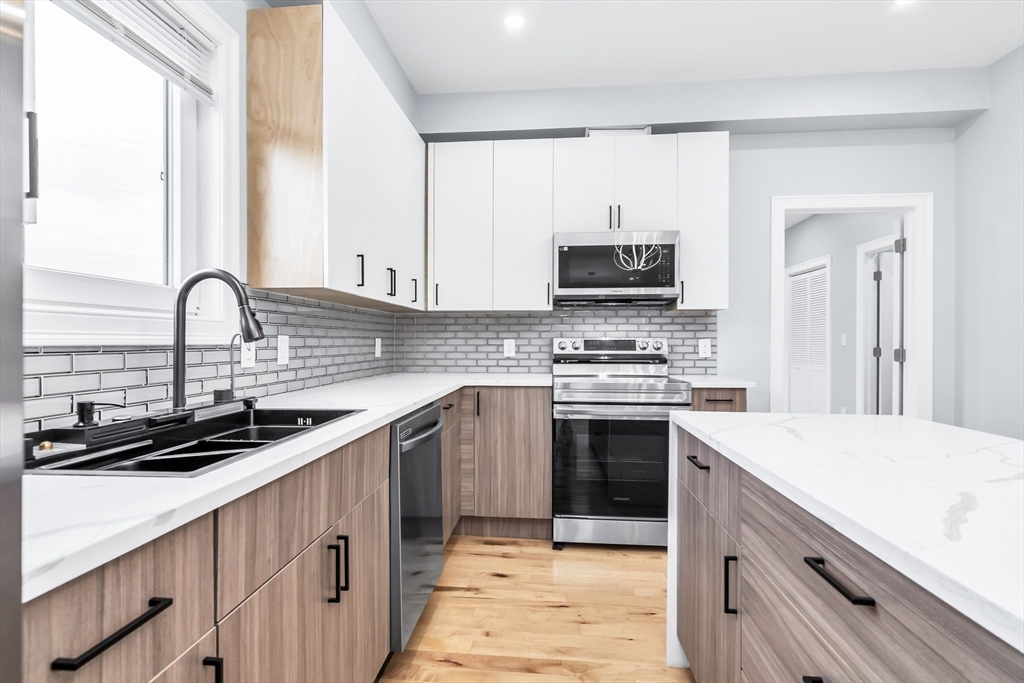 50 Maverick Street, Unit 3 Chelsea, MA 02150 - Photo 6 of 24 a kitchen with a sink stove and oven