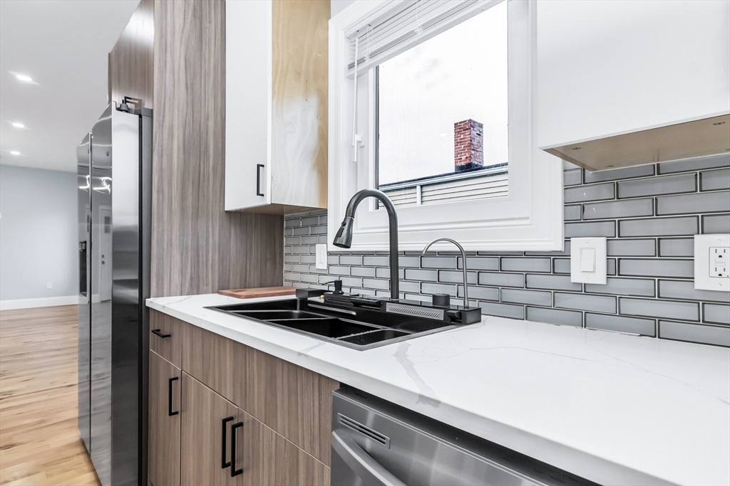50 Maverick Street, Unit 3 Chelsea, MA 02150 - Photo 7 of 24 a kitchen with a sink a stove and a refrigerator