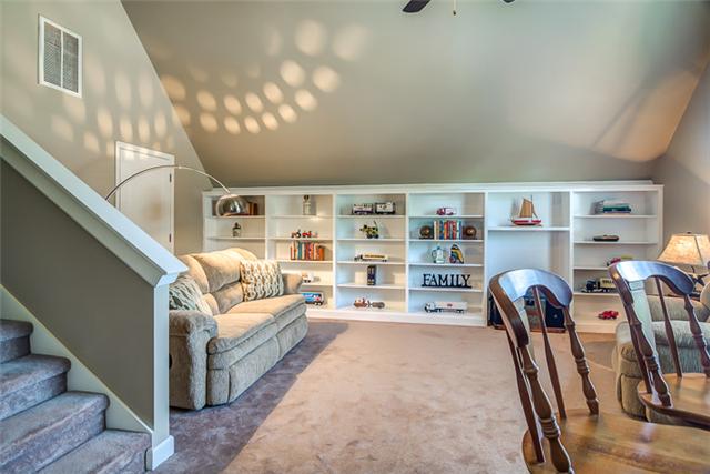 133 Ridgeview Trace Hendersonville, TN 37075 - Photo 15 of 20 The bonus room has been freshly painted and has large space-saving custom built-in bookshelves that can also be used as entertainment center. There is also access to even more storage from the bonus room. Perfect for seasonal items.