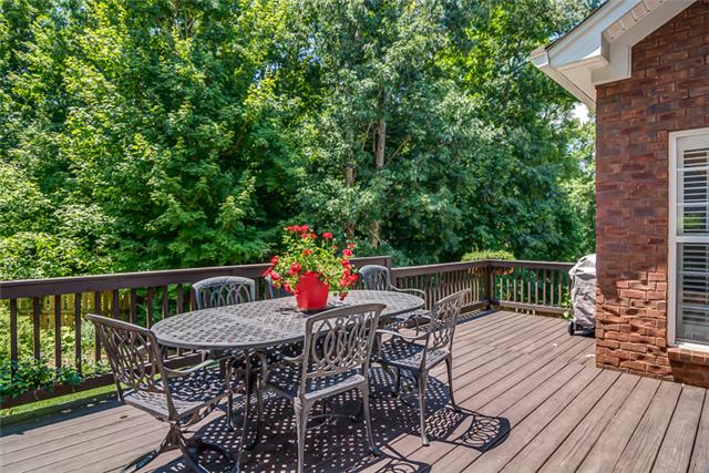 133 Ridgeview Trace Hendersonville, TN 37075 - Photo 16 of 20 The over-sized deck is perfect for entertaining and grilling out. Enjoy your morning coffee with mature trees and nice wooded common space behind your fenced in yard. Perfect for your little ones or pets.
