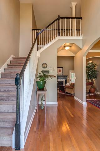 133 Ridgeview Trace Hendersonville, TN 37075 - Photo 3 of 20 Gleaming hardwoods and custom stained railing with open arched dining and soaring foyer give this home an instant wow factor from the first step inside.