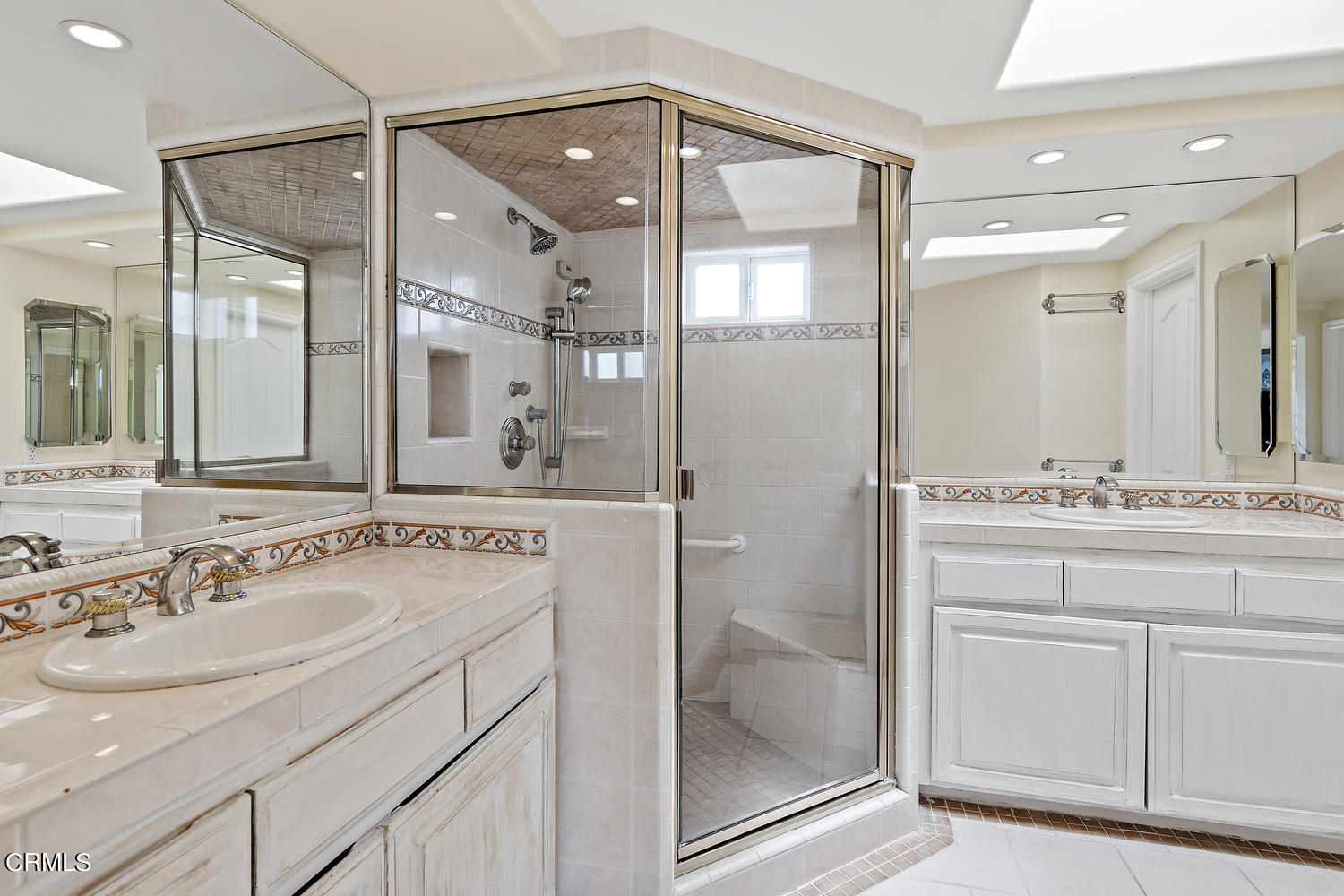 328 Lakeshore Drive Oxnard, CA 93035 - Photo 11 of 43 a bathroom with a sink vanity and a mirror