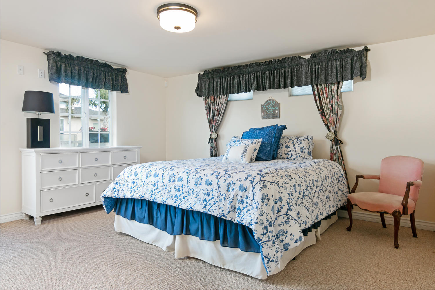 328 Lakeshore Drive Oxnard, CA 93035 - Photo 17 of 43 a bedroom with a bed a window and dresser