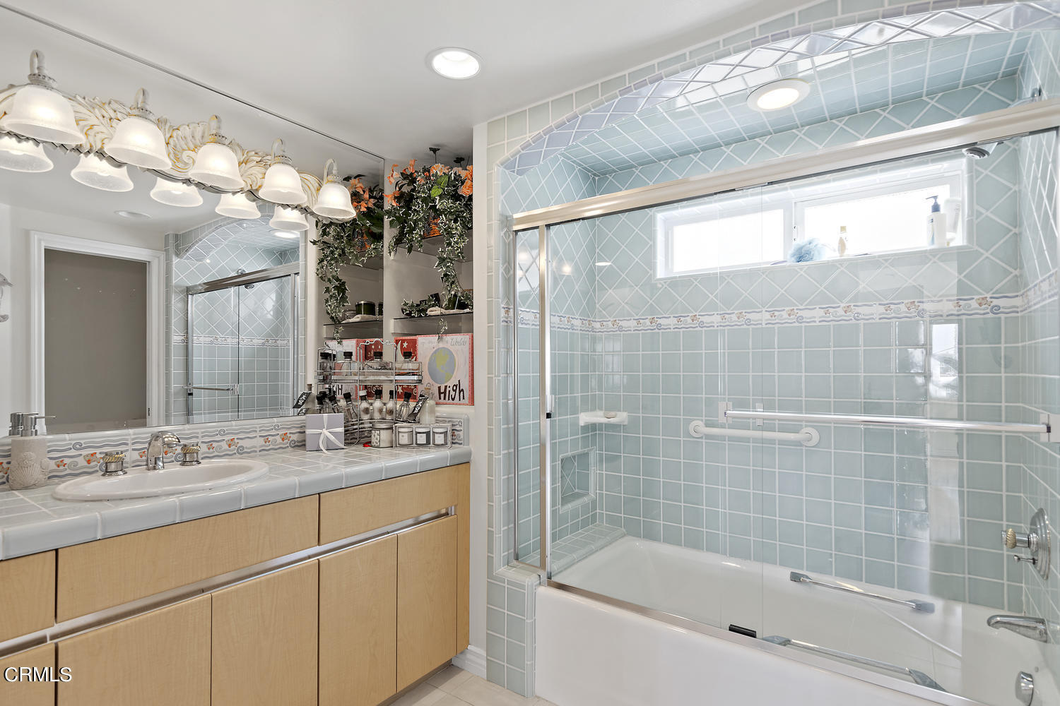 328 Lakeshore Drive Oxnard, CA 93035 - Photo 19 of 43 a bathroom with a sink mirror and a bathtub