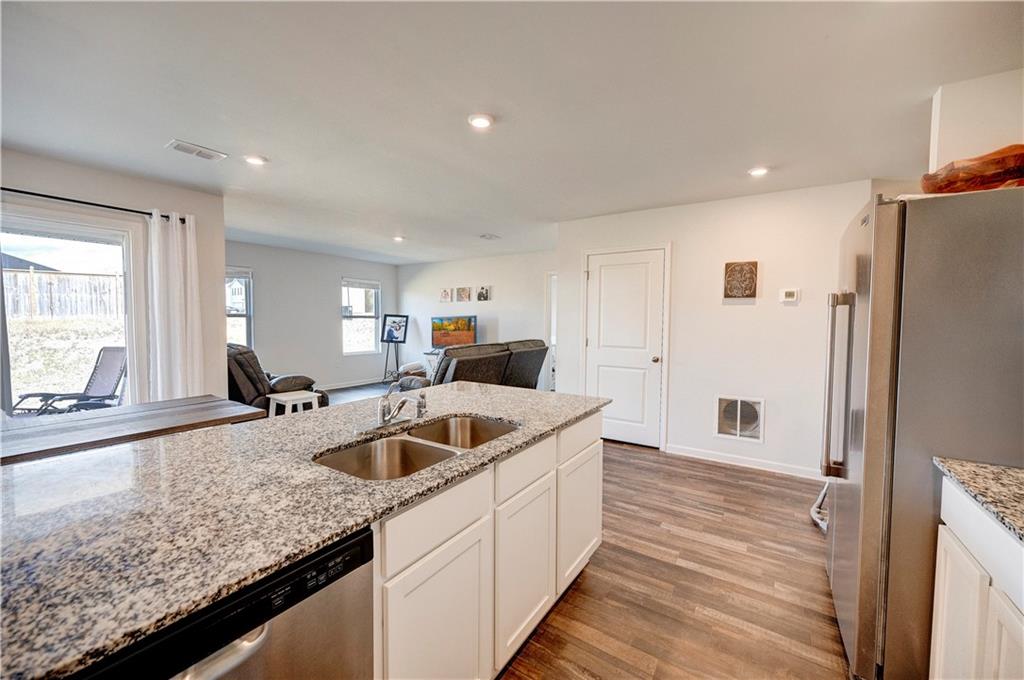 500 Pemberton Street Kingston, GA 30145 - Photo 11 of 46 a kitchen with a sink and a refrigerator